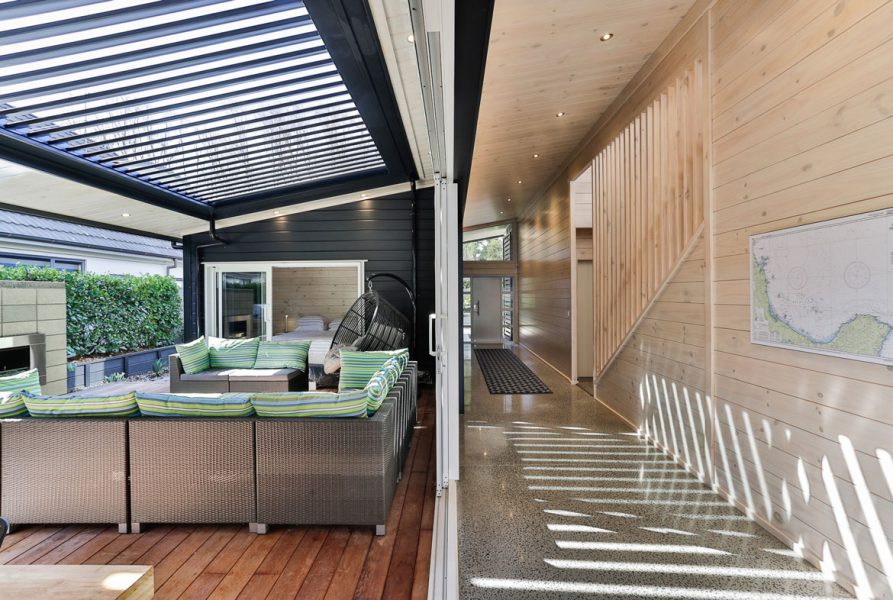 Lockwood Design and Build Home in Coromandel Peninsula Outdoor Entertaining Area with Ranch Slider and Hall