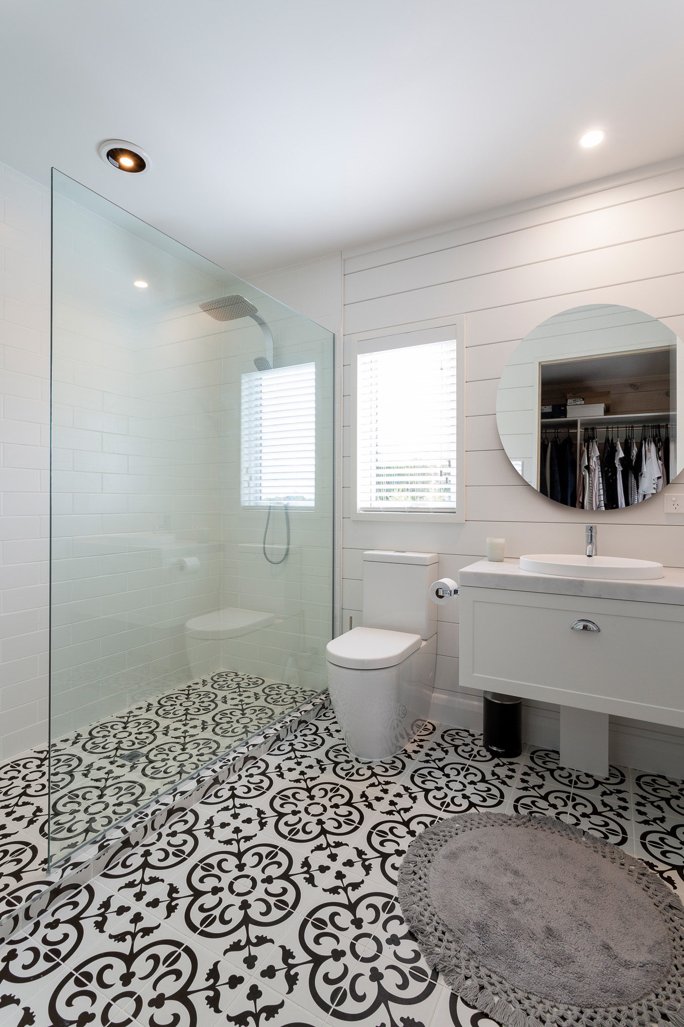 Fully painted Lockwood bathroom walls with black and white floor tiles