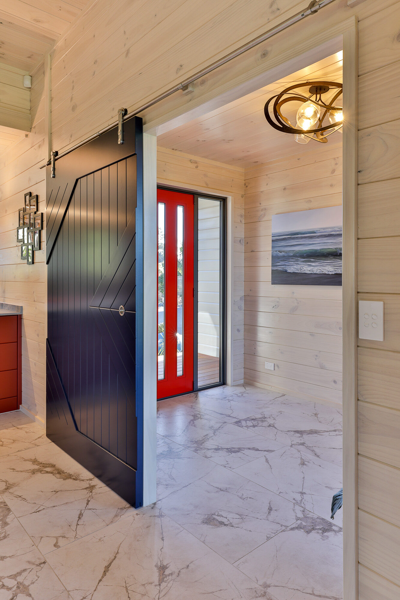 Bright blue barn doors add an extra feature to this home