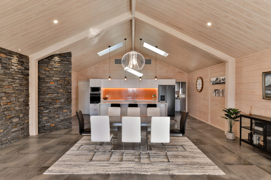 Neutral toned Lockwood kitchen with schist stone wall